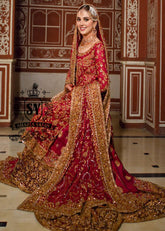 A dream bridal dress, long shirt entirely handcrafted in precious, impalpable chiffon. Adding to the majestic lehenga silhouette is a spectacular banarsi jamawar train, which flows with ethereal movements, giving the bride a scenic and luminous aura.