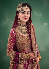 An elegant long Pishwas hand embellished wedding dress designed for the modern bride who wants to truly feel luxury on her wedding day. This dress is ideal for brides searching for a modern wedding dress, farshi bridal lehenga, or a lehenga wedding dress with train.