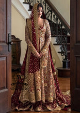 A wedding dress with a long train lehenga embroidered with crystals, created for an unparalleled look for the bride. The delicate embellishments softly sparkles with every movement, while the wedding gown silhouette beautifully highlights her natural elegance.