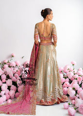 This Bridal dress is the true embodiment of elegance: delicate, silky Lame envelops the Lehenga silhouette, emphasizing every movement. Rich decoration creates a radiant effect - exquisite embroidery with pearls, beads and crystals adds depth and noble shine.