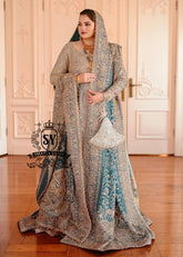 A royal look for a Full-figured bride will be created by this A-line long shirt with farshi lehenga dress made of luxurious lame fabric in Tradewind color.