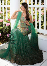 The moment you put on this bridal dress, you will feel like the star of a fairy tale. Rich and yet airy, this look combines a body-con kameez silhouette with a shimmering lehenga skirt.