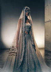 A luxurious bridal look, created by designers to fulfill your dream of a magnificent, fairytale-like bridal dress. Imagine yourself dancing in this bridal Lehenga Choli dress at the wedding hall, and you'll never want anything else. It's a stunning, super contemporary Lehenga design that definitely won't go unnoticed.
