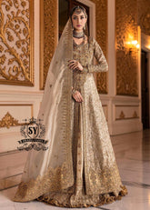 A Pakistani wedding dress is a captivating sight. Let your dreams become your wings in a wedding dress. This rich Beige gold maxi dress is adorned with carefully placed vibrant motifs, each crafted using tilla, kora Dabka, stones, sequins, beads, silk threads and swarovski crystals, and zardozi techniques.