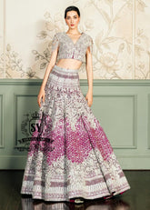 This Amaranth purple Lehenga choli Bridal dress is the embodiment of royal grandeur. A stunning wedding dress, every detail of which is designed to captivate. Exquisite embellishments, a sophisticated blouse, luxurious Beaded sleeves, and a delicate neckline create a truly aristocratic bride.