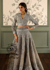 This breathtakingly beautiful bridal lehenga choli wedding dress will make any bride feel like an angel. A brilliance lies in every detail. This wedding dress explores the interplay of light through layers of tulle embellishments and intricate embroidery.