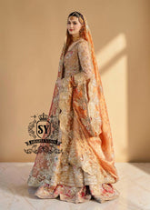 the Sultry beige color adds a modern touch to the traditional wedding dress. This ensemble is perfect for brides who want to combine classic elegance with contemporary fashion. A premium Pishwas Lehenga design ideal for brides seeking an elegant, sophisticated, and striking look.