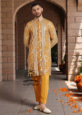 A luxurious mustard-gold kurta adorned with delicate floral and geometric embroidery — created for the man who believes in elegance, heritage, and refined festive style.