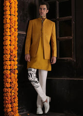 Adorn yourself in elegant attire with this Geebung-colored raw silk prince coat. The matching inner kurta and Off-White pajamas create a perfect match. Ideal for grooms.