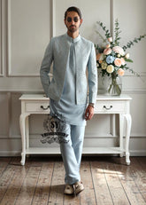 This Columbia Blue men's Prince Coat suit with a touch of embellishment is a conscious choice for men who prioritize quality and distinctive style.