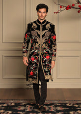 A Velvet sherwani crafted with refined detailing and florals elegance designed for the groom who lets craftsmanship speak louder than trends.