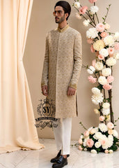 The signature elegance of the modern groom. A Sherwani suit that combines style, tradition, and premium tailoring. This elegant Bright Wood Sherwani dress blends timeless elegance with exquisite artistry, featuring beautiful embroidery that speaks of tradition and modern luxury.