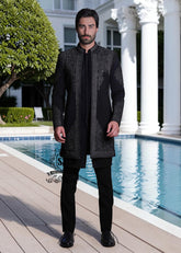 This front-open Sherwani suit boldly expresses a modern style, designed for the man who wants to exude presence without excessive ornamentation. Crafted from high-quality jet-black Korean suit fabric, the exquisite hand embroidery.