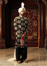 We love the striking contrast of the hand embellished sherwani and premium raw silk, which adds a touch of sophistication. The perfectly tailored cut create a spectacular silhouette for the groom seeking radiant and memorable elegance. An ultra-elegant and graceful look, perfect for a truly gentle wedding day.