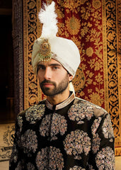 We love the striking contrast of the hand embellished sherwani and premium raw silk, which adds a touch of sophistication. The perfectly tailored cut create a spectacular silhouette for the groom seeking radiant and memorable elegance. An ultra-elegant and graceful look, perfect for a truly gentle wedding day.