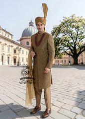 For the noble groom, a sophisticated and sharp Quartz Ochre sherwani, crafted from luxurious masoori net and adorned with exquisite jewels and timeless Zari embroidered floral motifs, was layered over a Quartz Ochre colored kurta set.