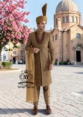 For the noble groom, a sophisticated and sharp Quartz Ochre sherwani, crafted from luxurious masoori net and adorned with exquisite jewels and timeless Zari embroidered floral motifs, was layered over a Quartz Ochre colored kurta set.