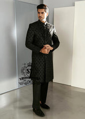 Black Embroidered Sherwani dignified and sophisticated design, this sherwani in deep black exudes power and elegance. Crafted from premium fabric, intricate embroidery that adds a touch of regal artistry without overpowering its sleek silhouette. The refined tailoring make it an ideal choice for grooms, formal receptions, and grand celebrations.