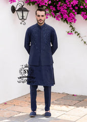 A stylish waistcoat crafted from luxurious navy blue raw silk fabric. The waistcoat itself, the front, and the sleeves are adorned with intricate threadwork and embroidery, giving it a refined and traditional feel.