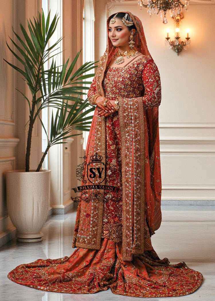 Barn Red red lehenga for a Pakistani wedding ceremony is a Mughal-inspired Bridal dress adorned with lightest hand embroidery and exquisite embellishments that will make you look stunning at your wedding. Fast Shipping available.