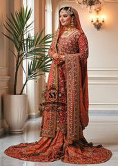 Barn Red red lehenga for a Pakistani wedding ceremony is a Mughal-inspired Bridal dress adorned with lightest hand embroidery and exquisite embellishments that will make you look stunning at your wedding. Fast Shipping available.