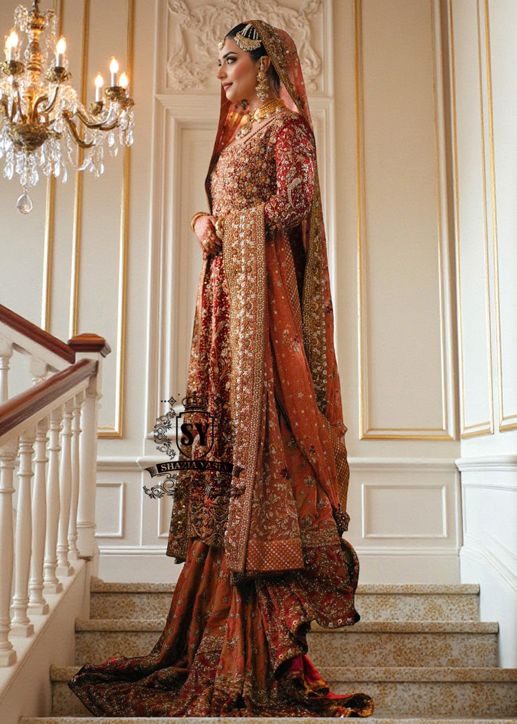 Barn Red red lehenga for a Pakistani wedding ceremony is a Mughal-inspired Bridal dress adorned with lightest hand embroidery and exquisite embellishments that will make you look stunning at your wedding. Fast Shipping available.