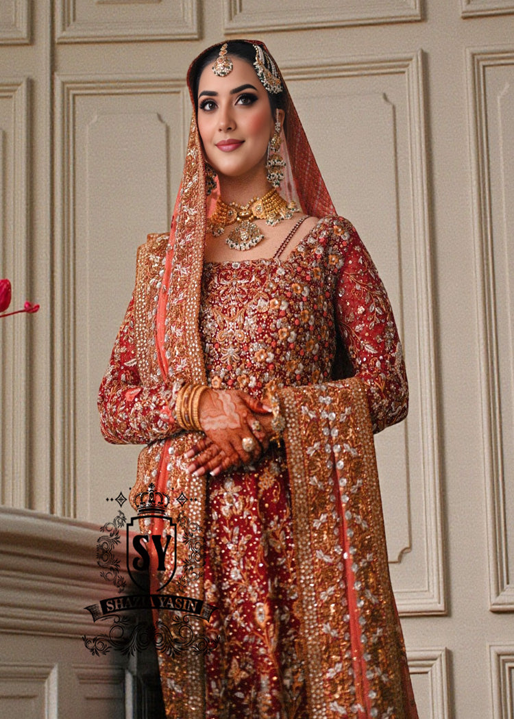 Barn Red red lehenga for a Pakistani wedding ceremony is a Mughal-inspired Bridal dress adorned with lightest hand embroidery and exquisite embellishments that will make you look stunning at your wedding. Fast Shipping available.