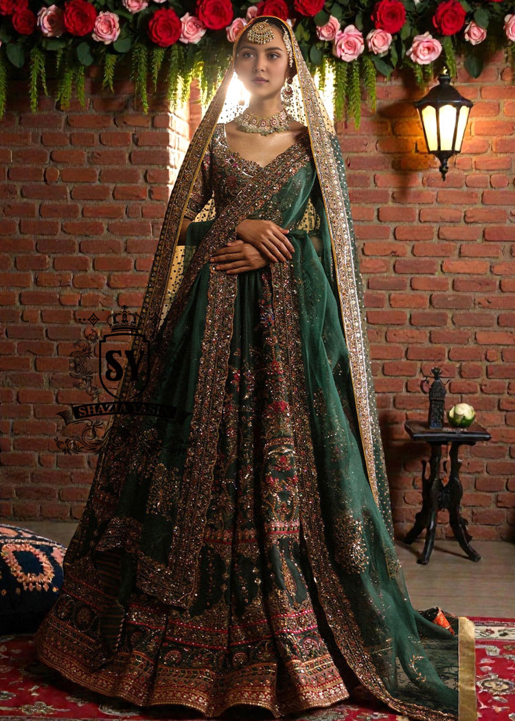 Get the look in this stunning Emerald Luxe Bridal Lehenga Choli with a touch of ruby — the perfect blend of elegance and timeless glamour for your special day.
Let us help you create unforgettable memories with a look that truly shines.