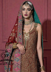Immerse yourself in the timeless brilliance of a Pakistani couture bridal lehenga. Vibrant traditional hues of red are lightly interwoven with shimmering gold, enveloping the bride in an aura of glamour and grace.