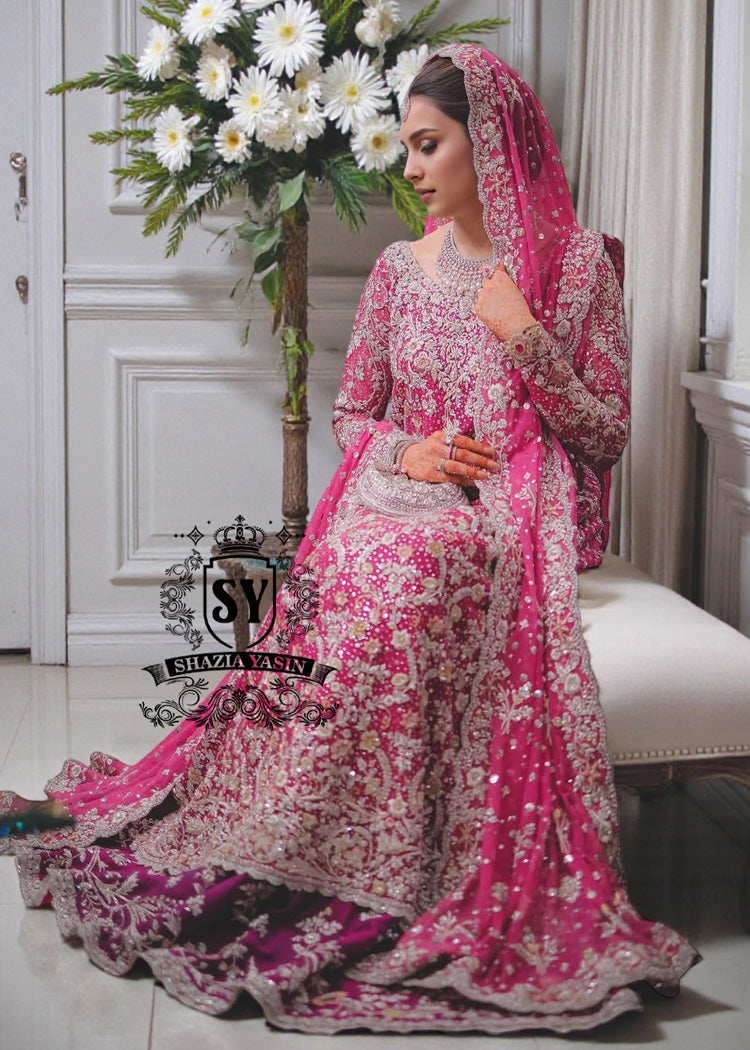 A dream wedding dress, designed to enhance the beauty and elegance of the wearer. This exquisite long shirt silhouette perfectly blends A-line Lehenga style with a touch of sophistication. 