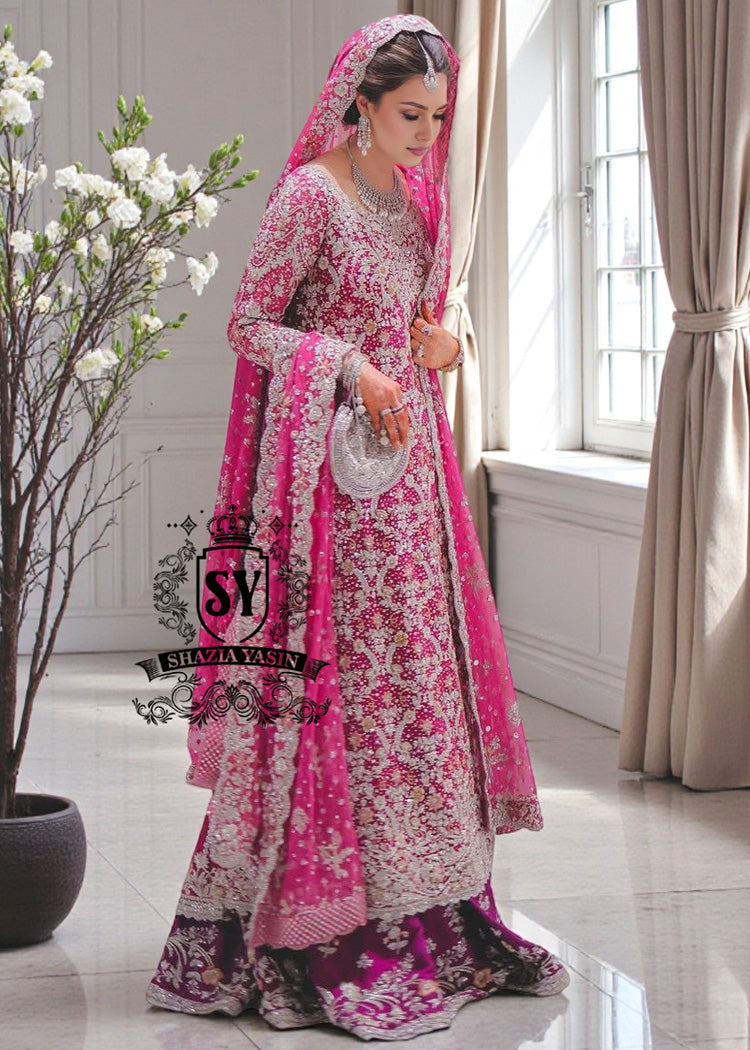 A dream wedding dress, designed to enhance the beauty and elegance of the wearer. This exquisite long shirt silhouette perfectly blends A-line Lehenga style with a touch of sophistication. 