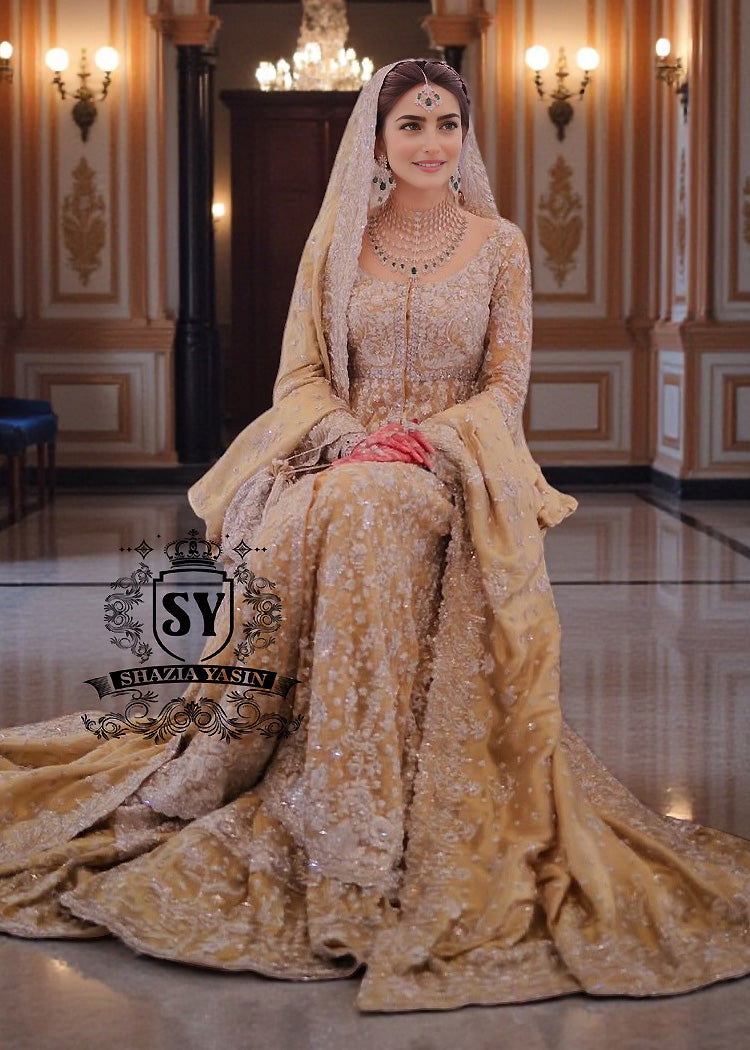 Golden Glow Wedding Dress: A Magical Transformation.
Discover the enchanting Pishwas Wedding Dress that blends timeless elegance with modern farshi lehenga design. Perfect for the sophisticated bride!