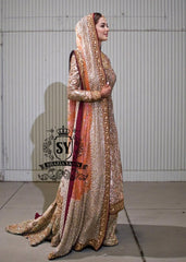 Charming A-line wedding dress with long Fully embellished sleeves and a boat neckline, with a voluminous princess-style lehenga skirt with a spectacular train.