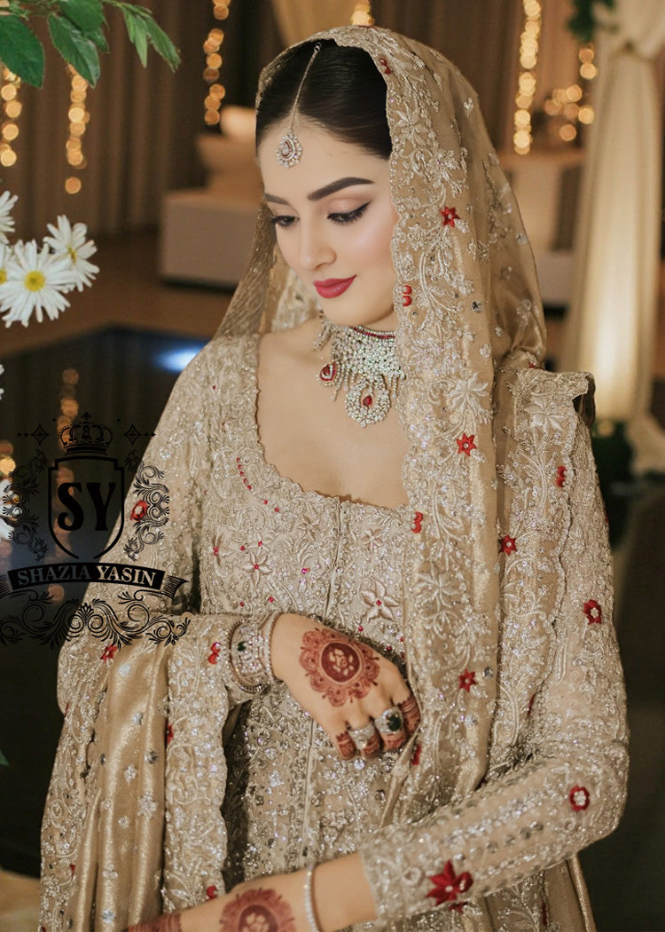 A Pishwas Dress that shimmers like a quiet celebration, made to illuminate your walk down the aisle and wrap every step in a soft, radiant glow. Luxury Lehenga Crafted with meticulous detail, it turns the calm magic of winter into a moment of pure brilliance.