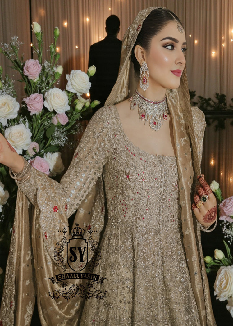 A Pishwas Dress that shimmers like a quiet celebration, made to illuminate your walk down the aisle and wrap every step in a soft, radiant glow. Luxury Lehenga Crafted with meticulous detail, it turns the calm magic of winter into a moment of pure brilliance.