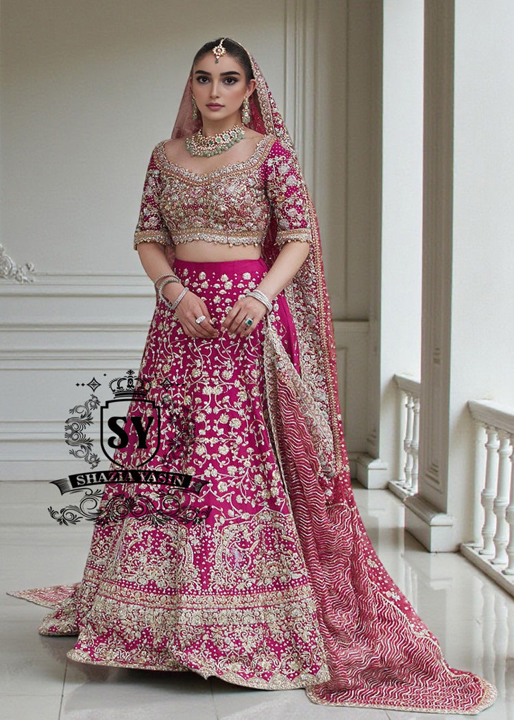 The Dogwood Rose bridal look evokes an aura of ancient majesty. A richly hand-embellished lehenga choli, structured yet flowing, sparkles with dabka details, stones, sequins, beads, silk threads, and Swarovski crystals. Paired with layered raw jewels and a striking jewel-pink dupatta, it captures the grandeur of old-world bridal elegance through a contemporary lens.