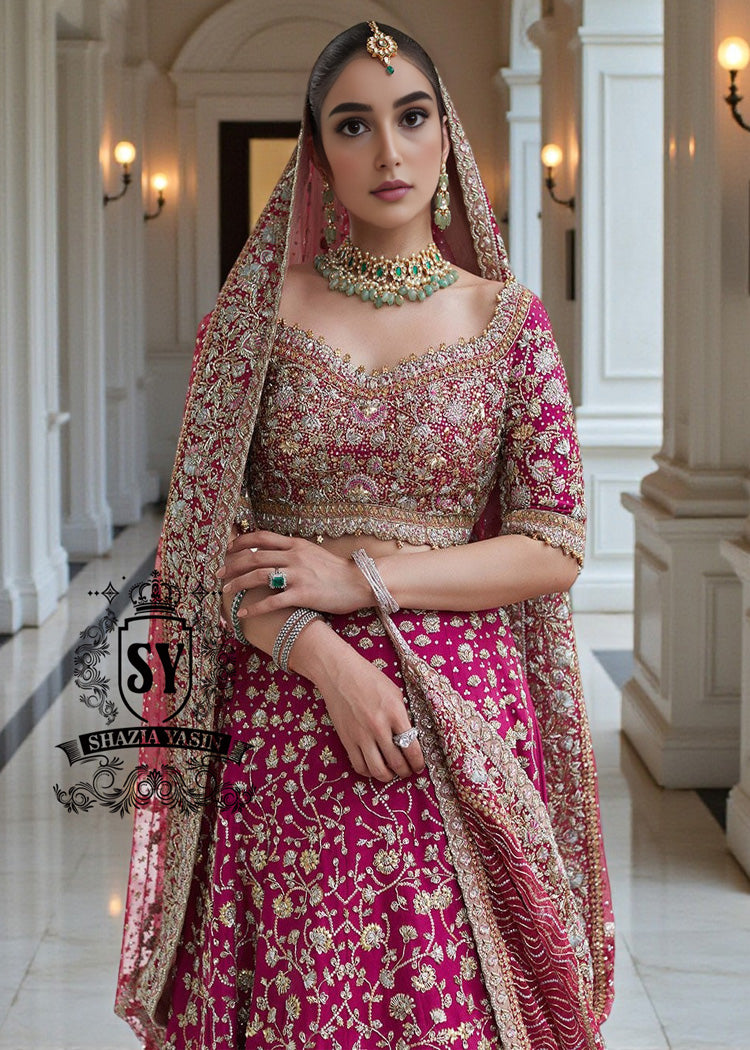 The Dogwood Rose bridal look evokes an aura of ancient majesty. A richly hand-embellished lehenga choli, structured yet flowing, sparkles with dabka details, stones, sequins, beads, silk threads, and Swarovski crystals. Paired with layered raw jewels and a striking jewel-pink dupatta, it captures the grandeur of old-world bridal elegance through a contemporary lens.
