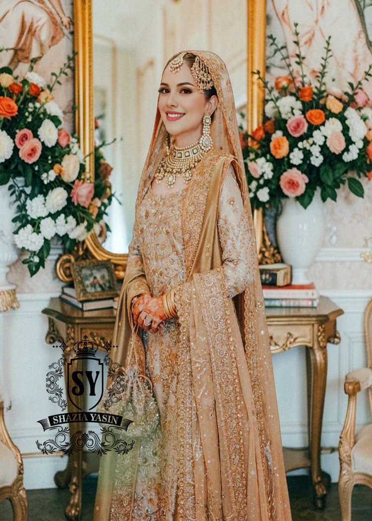 An embellished bridal dress with royal silhouette farshi Lehenga, embodying the perfect blend of classic sophistication and ethereal romance. The Crystal embroidery asserts itself, scattered in places, dense in others, evoking radiant brilliance throughout.