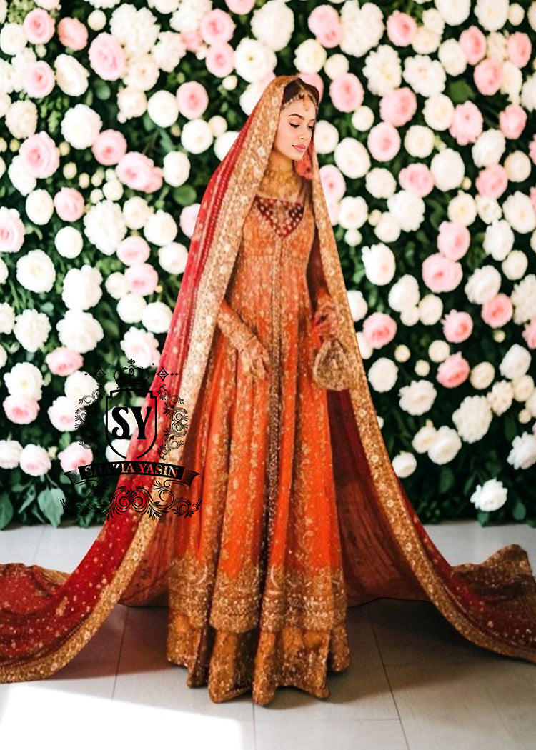 A traditional Pakistani bride epitomizes royal elegance in our newest bridal Pishwas Lehenga dress.