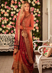 A traditional Pakistani bride epitomizes royal elegance in our newest bridal Pishwas Lehenga dress.