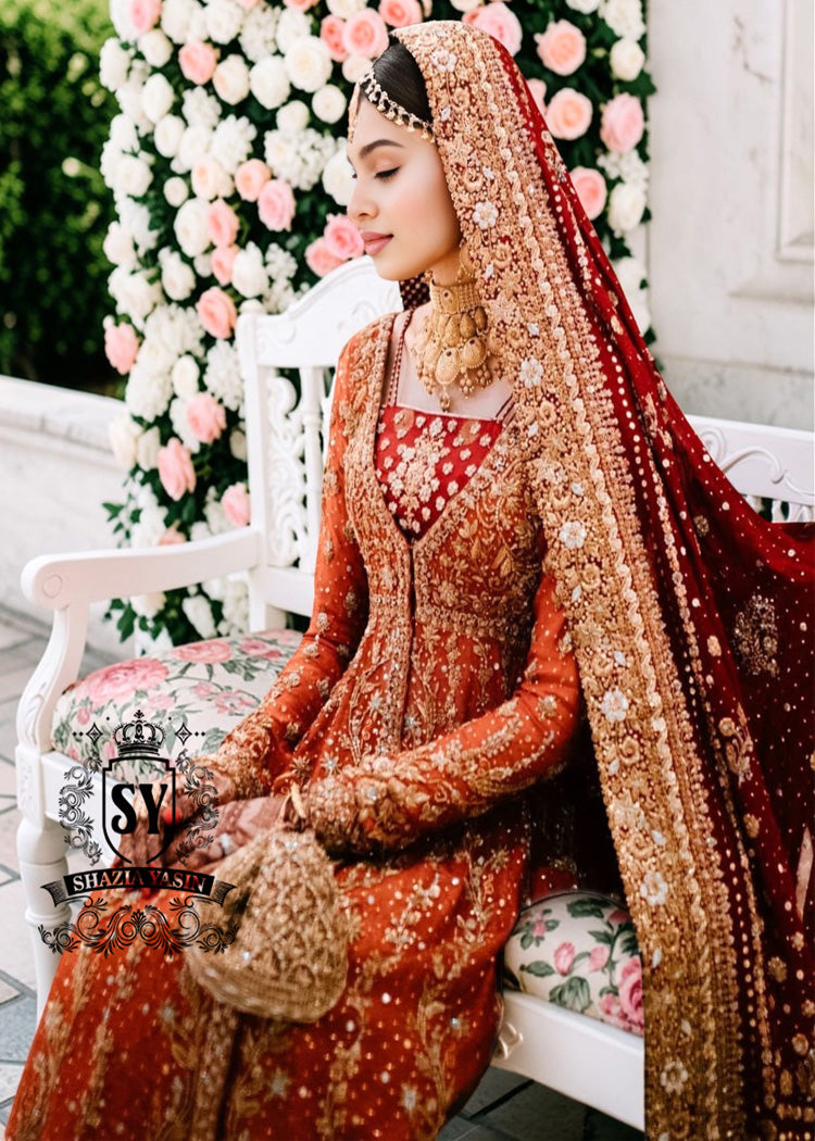 A traditional Pakistani bride epitomizes royal elegance in our newest bridal Pishwas Lehenga dress.