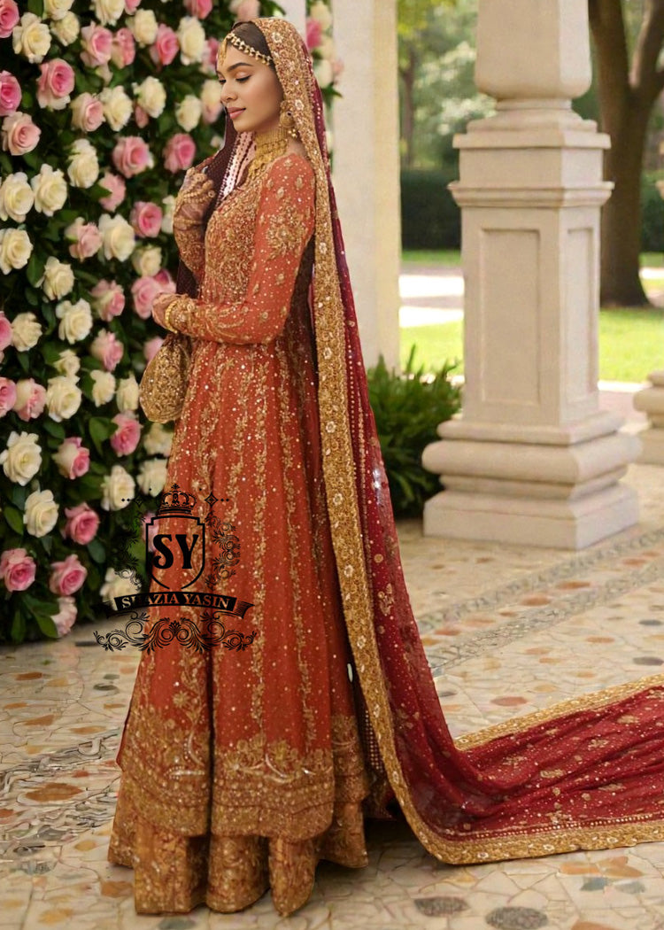 A traditional Pakistani bride epitomizes royal elegance in our newest bridal Pishwas Lehenga dress.