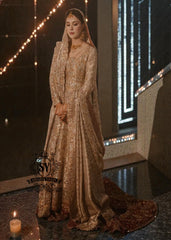 A vision of divine luminosity, this pishwas glimmers like starlight with every movement. Her Lehenga features intricate gold embroidery, delicate florals and crystal embellishments, while her lame dupatta envelops her like a dream.