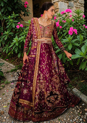 This striking two-tone Berry and Berry Burgundy lehenga choli is heavily embellished with shimmering gold handwork and harmonious silk threadwork for a modern classic look. The luxurious bodice is hand-embellished with diamante detailing, making you stand out in the crowd.