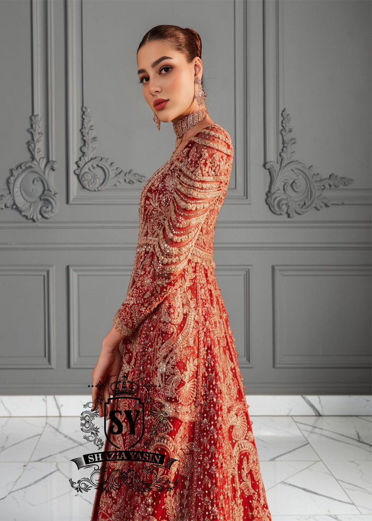A masterpiece of an embellished long gown, featuring a jamawar bustier, a daring front slit and tulle sleeves with elongated beaded cuffs. Perfect for the red carpet, this Lehenga bridal dress brings Bollywood glamour all the way down the aisle.