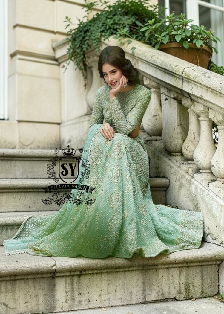 Experience the epitome of haute couture bridal fashion with Shazia Yasin's iconic Lehenga choli dresses, where soft Chiffon meets stunning silhouettes and unparalleled craftsmanship.