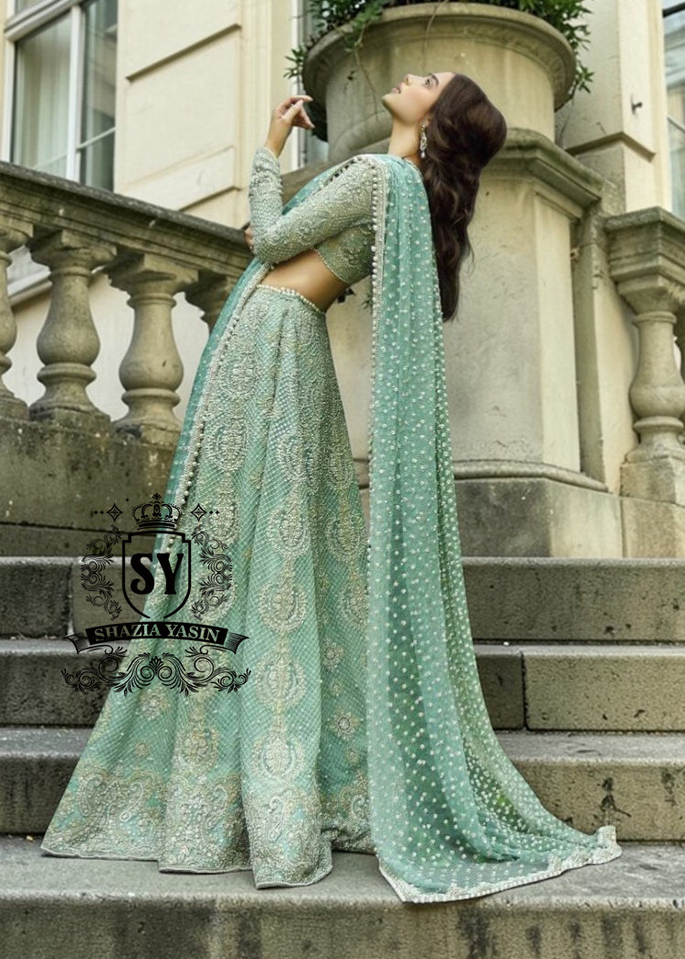 Experience the epitome of haute couture bridal fashion with Shazia Yasin's iconic Lehenga choli dresses, where soft Chiffon meets stunning silhouettes and unparalleled craftsmanship.