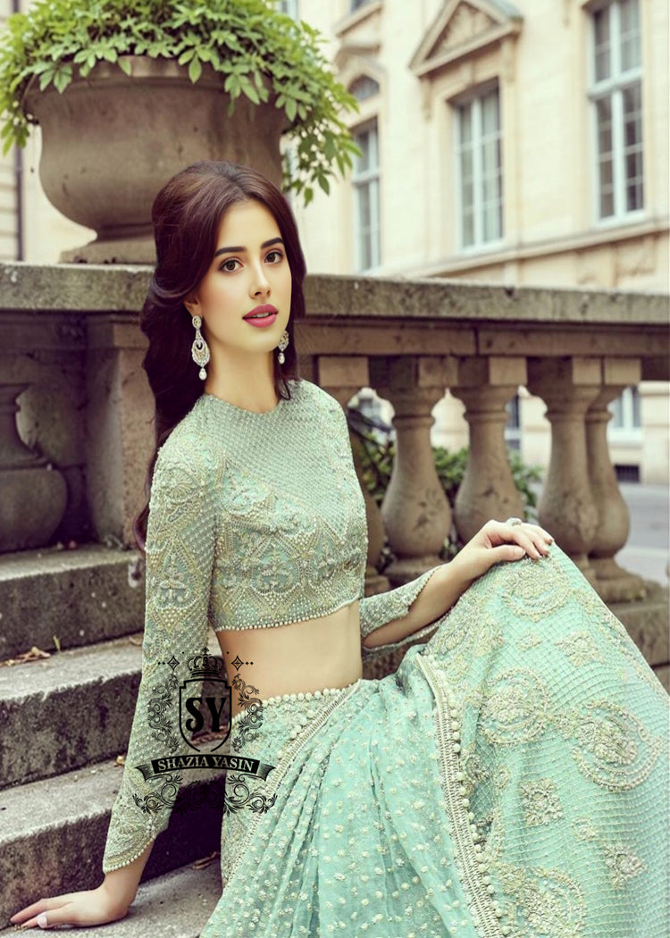Experience the epitome of haute couture bridal fashion with Shazia Yasin's iconic Lehenga choli dresses, where soft Chiffon meets stunning silhouettes and unparalleled craftsmanship.