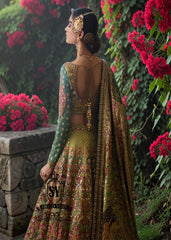 A stunning dark apple green lehenga featuring digital print and luxurious embroidery. The Choli Blouse is hand-applied with intricate floral appliqués, giving it a glamorous look. 