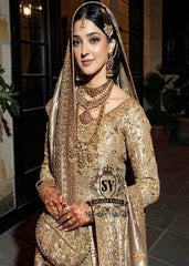 A majestic wedding dress made of luxurious Lame fabric in a lush farshi lehenga silhouette that radiates elegance. Long shirt creates an exquisite effect. The decor in the form of delicate flourishing embellishments adds romance.